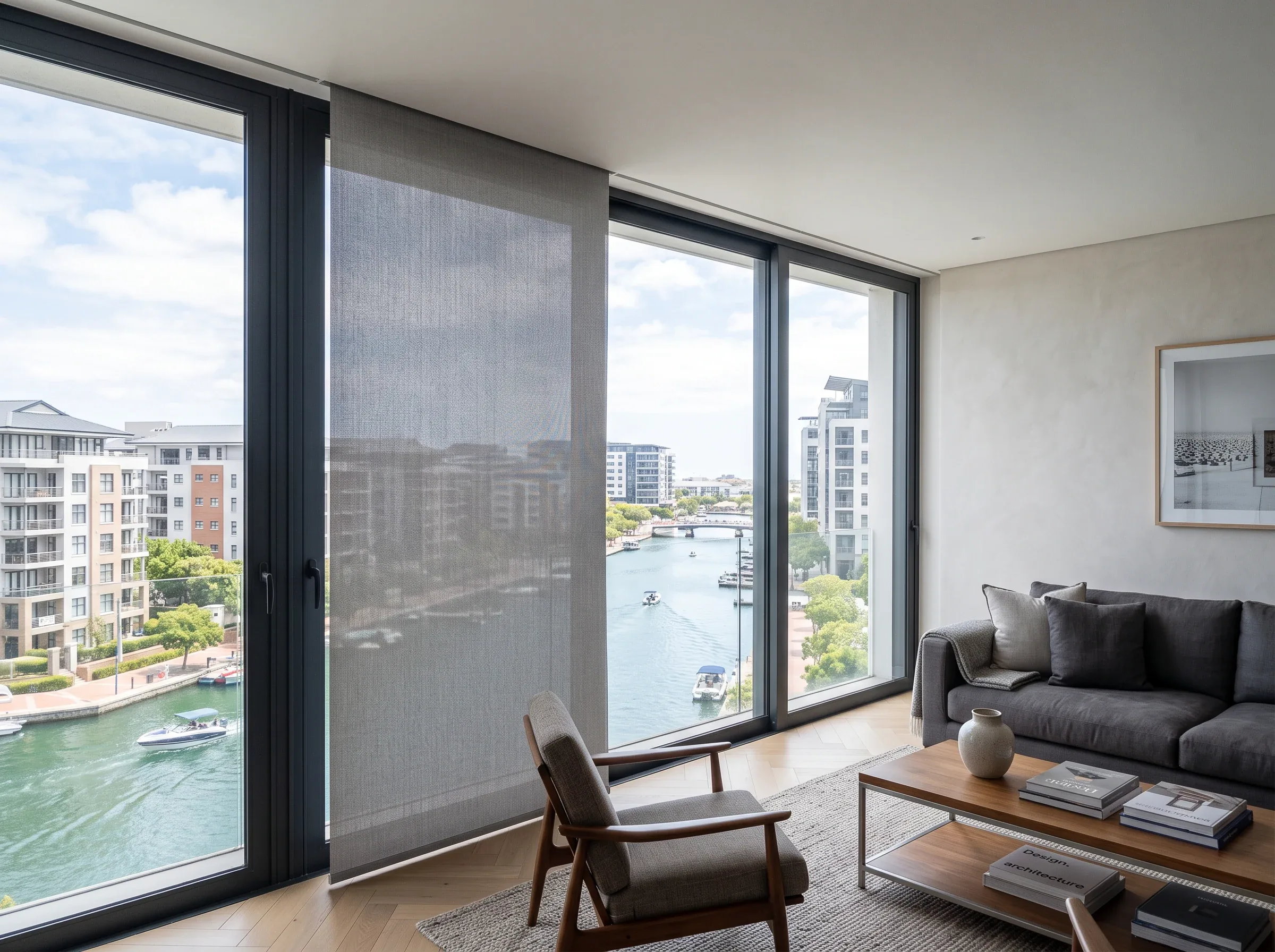 Roller blind fabric dropping from a slim concealed ceiling recess across a full-height window in a Century City apartment